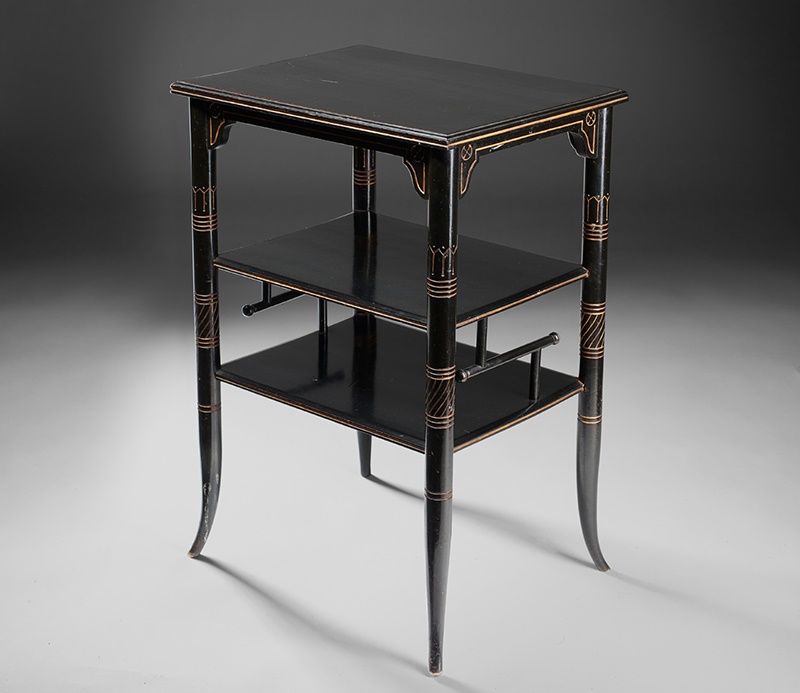 LOT 35 | E. W. GODWIN (1833-1886), PROBABLY FOR GILLOW & CO. | AESTHETIC MOVEMENT ‘COFFEE TABLE’, CIRCA 1880 ebonised birch with incised and gilded decoration | 48cm long, 69.5cm high, 37.5cm deep | Sold for £17,500 incl premium